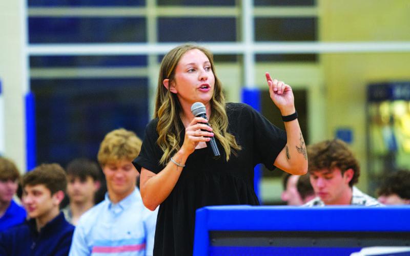 Macey Wooten tells the audience how proud she is of the group of girls she coached. HUNTER KING | DISPATCH RECORD