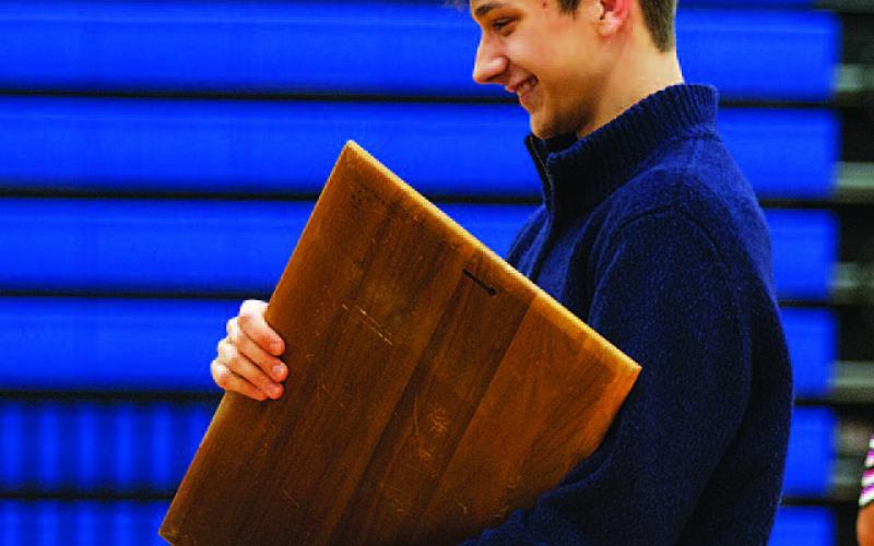 Luke Shivers smiles with the Battlin’ Badger award. HUNTER KING | DISPATCH RECORD