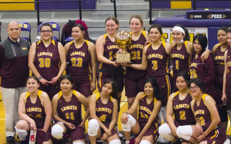 The Lometa Lady Hornets celebrate a bi-district championship victory over Gustine in Early on Saturday. JEFF LOWE | DISPATCH RECORD