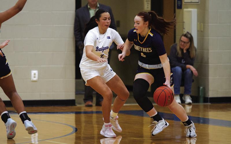HUNTER KING | DISPATCH RECORD Johnnie Lewis defends the Stephenville ball handler during the Lady Badgers’ win over the Honeybees this week.