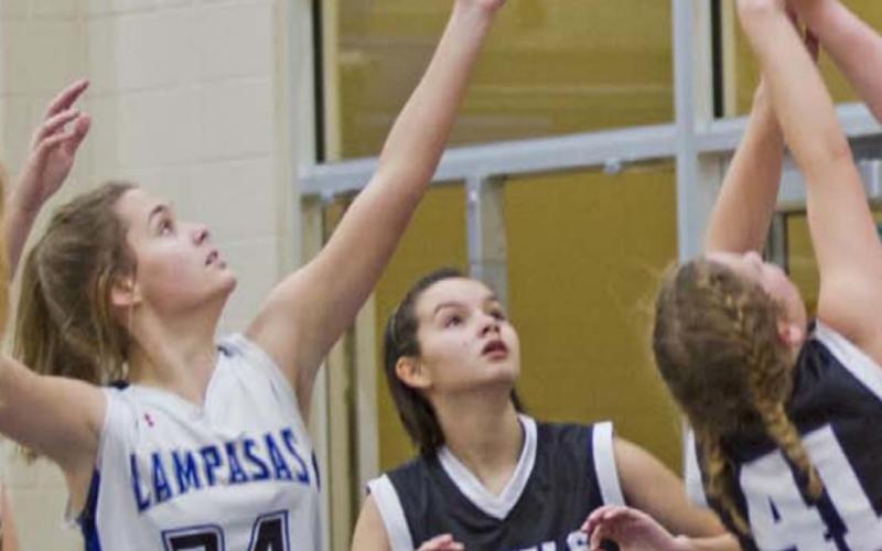Lady Badger freshman Jamie Ball (34) goes for a defensive rebound in the Lady Badgers’ third straight win. JEFF LOWE | DISPATCH RECORD