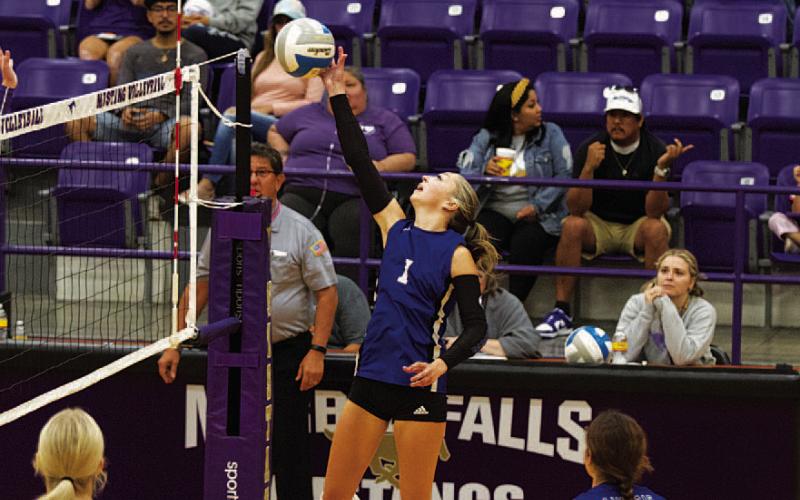 HUNTER KING | DISPATCH RECORD Brailey Wilson leaps and reaches to tap the ball over the net during the Lady Badgers’ match against Marble Falls on Tuesday. She will play her final match tonight in Salado.