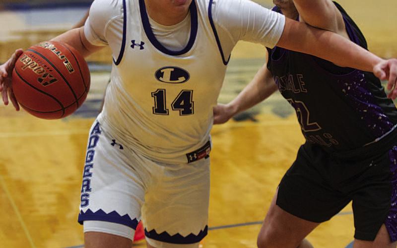 Dylan Polmanteer drives past a Marble Falls defender in the first half. HUNTER KING | DISPATCH RECORD