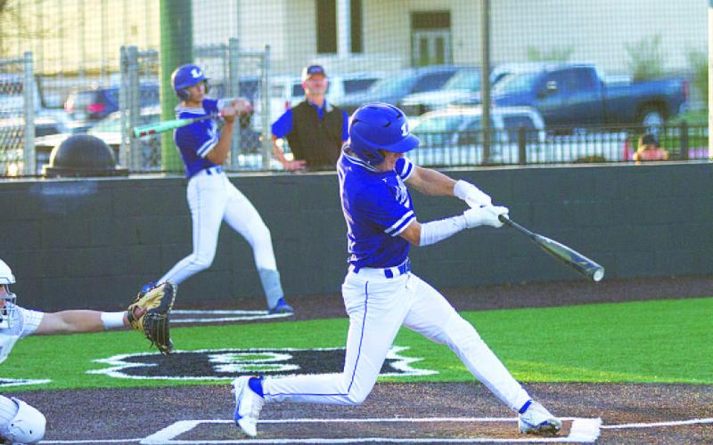 HUNTER KING | DISPATCH RECORD Cory White swings and hits a fly ball into the outfield against Burnet.