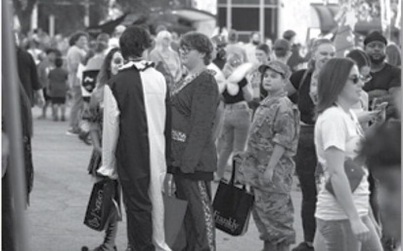 All kinds of costumes could be seen at Squared Silly, as hundreds of people celebrated Halloween by playing games and winning prizes on the town square. hunter king | Dispatch record