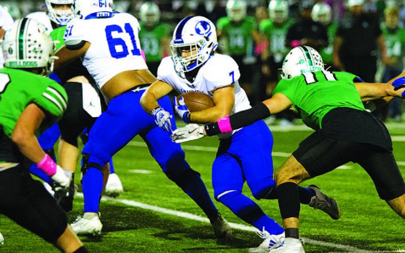 HUNTER KING | DISPATCH RECORD Daemian Rivas runs through a hole in the Burnet defense. He will need to be a factor in tonight’s game as well.