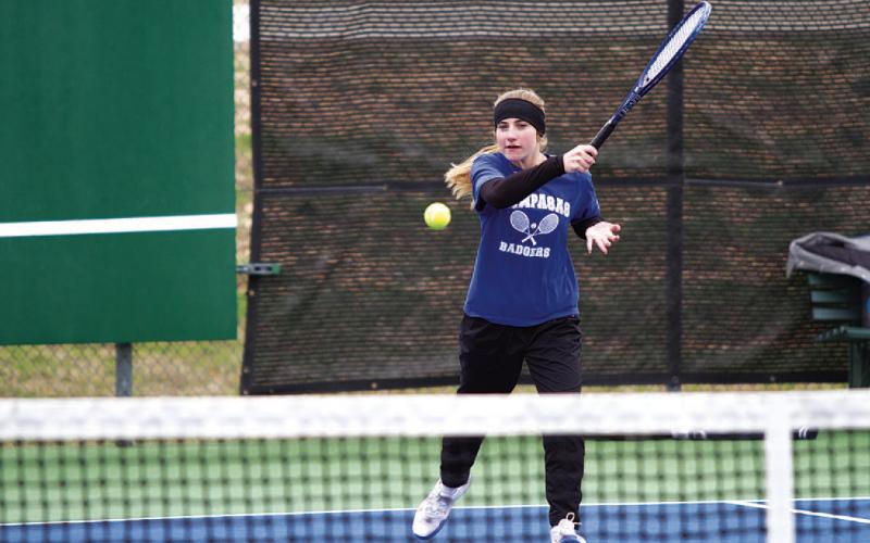 HUNTER KING | DISPATCH RECORD Loretta Hodges swings through a forehand shot during the tournament last Friday afternoon.
