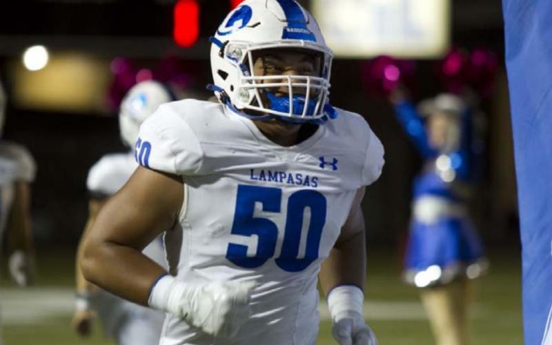 Sosa Sokimi runs out of the tunnel ahead of the Badgers’ game against LBJ. HUNTER KING | DISPATCH RECORD