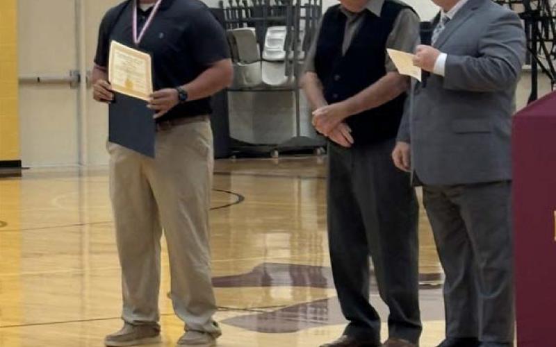 D.T. Torres, at left, was the Lometa educator selected to receive the Lamar Medal this school year from the Saratoga Lodge #546, represented by Bob Caughron and Paul Plourde who made the presentation on Tuesday. Courtesy photo