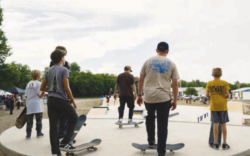 ADAM BARRIOS | DISPATCH RECORD Skaters wait for their chance to perform a trick.