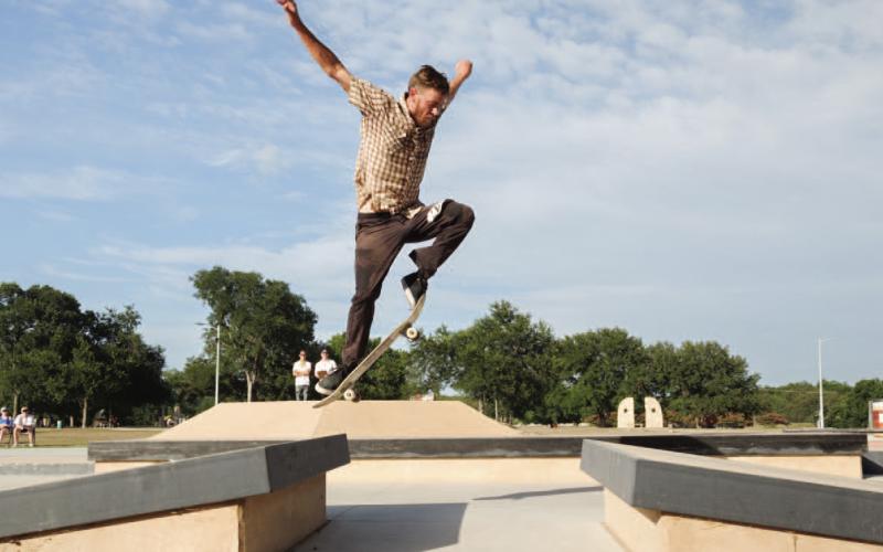 ADAM BARRIOS | DISPATCH RECORD Paul Konecci performs a jump at the skate park event during Spring Ho.