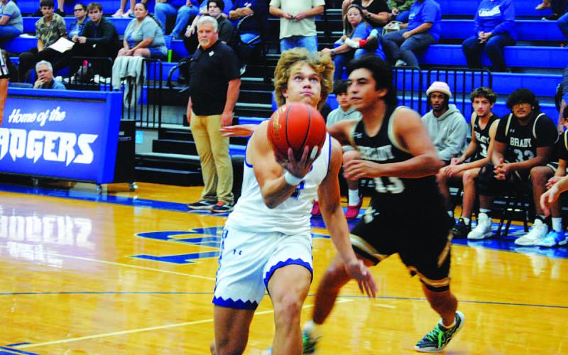 Haegan Oncken goes up in the paint for two of his seven points in Tuesday’s matchup. HUNTER KING | DISPATCH RECORD