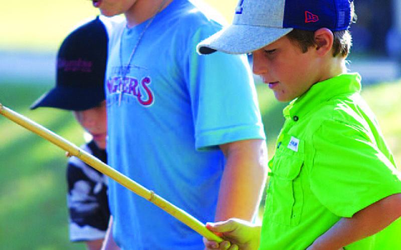 Easton and Landon Garner wait for a bite. HUNTER KING | DISPATCH RECORD