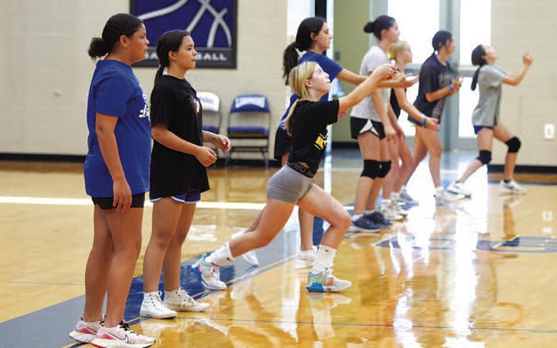 HUNTER KING | DISPATCH RECORD Middle school and incoming freshman Lady Badgers work on passing during volleyball camp last Wednesday morning.