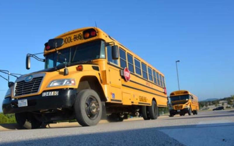 In this file photo school buses were lined outside of Taylor Creek Elementary on the first day of school. MONIQUE BRAND | DISPATCH RECORD