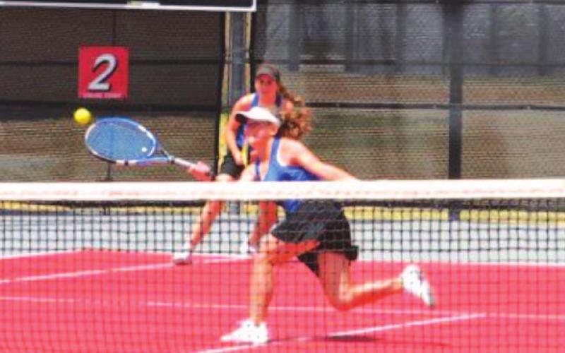 Abby Valdez runs to hit a shot near the net during her match with partner Kailr Clements at regionals. COURTESY PHOTO