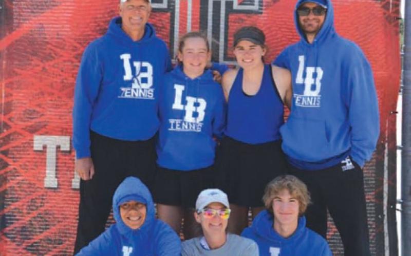 Badger tennis poses for a photo at the regional tournament. COURTESY PHOTO