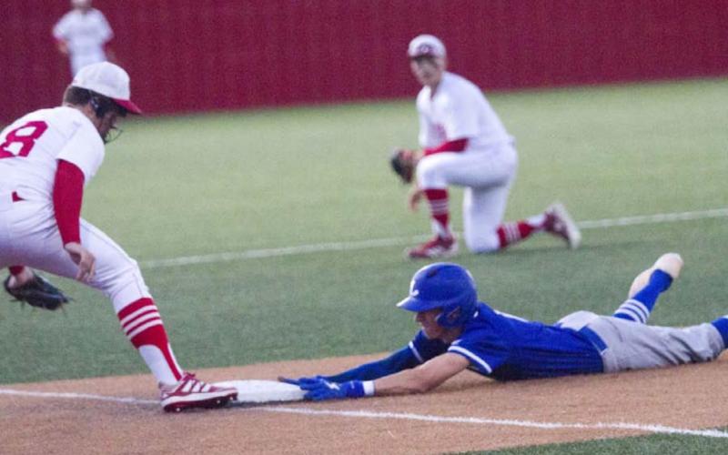 Logan Coleman slides safely into third on a triple to set up the Badgers’ first run at Glen Rose on Friday. JEFF LOWE | DISPATCH RECORD