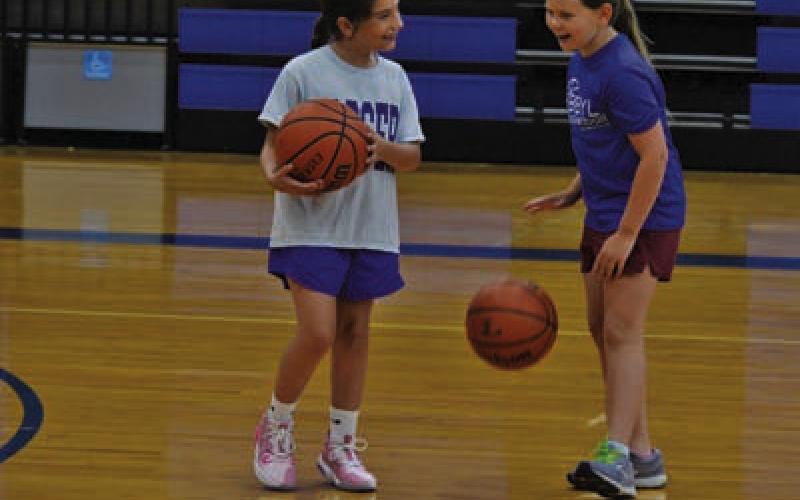 Campers share a laugh before Wednesday’s camp activities at Lampasas High School get started. ERICK MITCHELL | DISPATCH RECORD