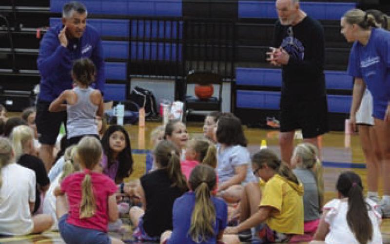Lady Badgers head basketball coach Marcus Chapa meets campers on Wednesday. ERICK MITCHELL | DISPATCH RECORD