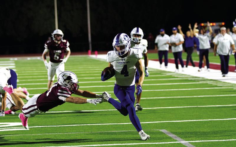 Shawn Roberts evades the Brownwood defender for the first touchdown of the game. HUNTER KING | DISPATCH RECORD