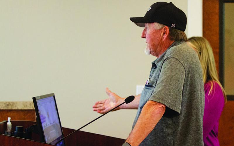 Businessman Deorald Finney offers information to the Lampasas City Council on his proposed four-story hotel, restaurant and retail center. HUNTER KING | DISPATCH RECORD