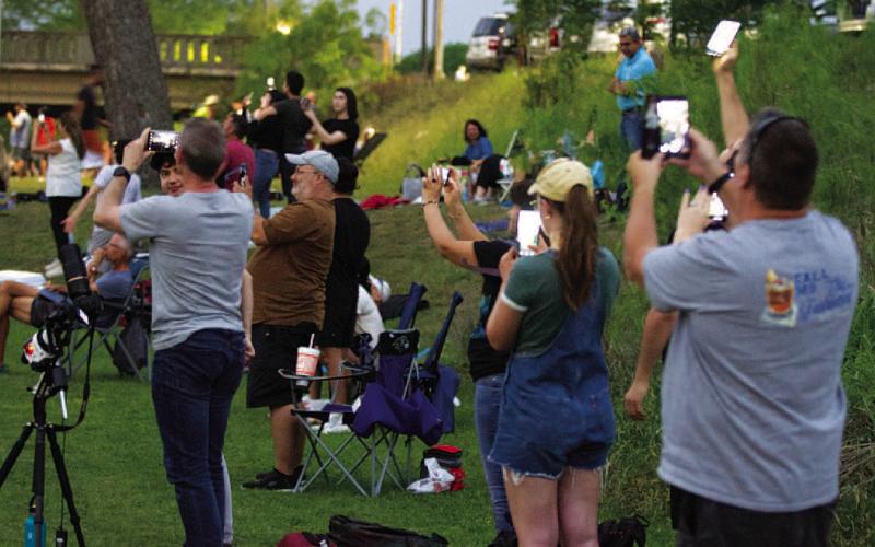 Although cloudy weather conditions kept many travelers away, hundreds of visitors still made their way to Lampasas to observe the eclipse from various vantage points, including city parks. The skies cleared in time to reward their efforts to view the solar phenomenon. FILE PHOTO