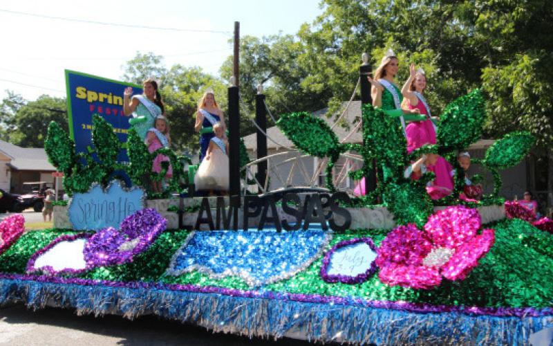 Spring Ho Queen Julia Ybarra is accompanied by her royal court members Neely Miller, Daecee Ellis, Allison Carroll Martin, Emma Jean Guthrie, Sailor Grace Ford, Maddie Gouak and Abigael Glass as they wave to the crowd from their float. JOYCESARAH MCCABE | DISPATCH RECORD