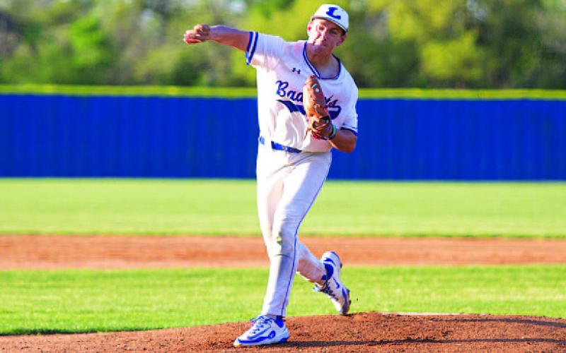 HUNTER KING | DISPATCH RECORD Calvin Phelps releases a pitch early in his outing against Marble Falls on Tuesday.