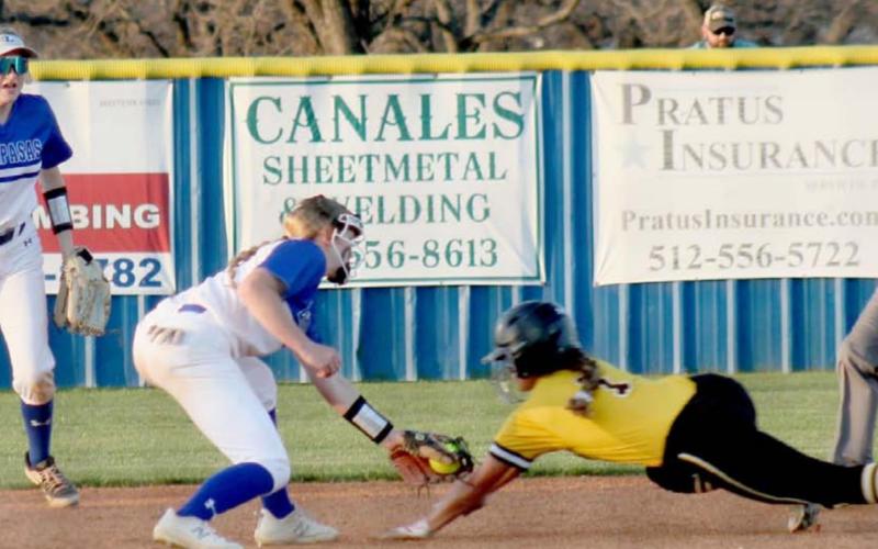 Aspen Wheeler lays down a tag, while Autumn Beisel-Macomber backs her up on the play. CHRIS YBARRA | DISPATCH RECORD