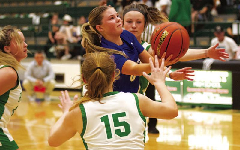 HUNTER KING | DISPATCH RECORD Addison Borchardt fights through contact to try and make a layup.