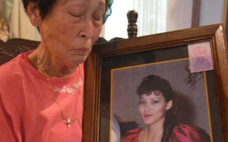 Sam-Soon Campbell holds a portrait of her missing daughter Elizabeth Campbell inside the family’s home in Killeen. It has been 33 years since Elizabeth disappeared. MONIQUE BRAND | DISPATCH RECORD