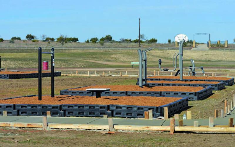 Completion of the workout stations at the FM 580 Sports Park nears its end on Tuesday afternoon. ERICK MITCHELL | DISPATCH RECORD