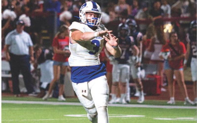 HUNTER KING | DISPATCH RECORD Reed Jerome flips a pass out to the flat during last week’s game.