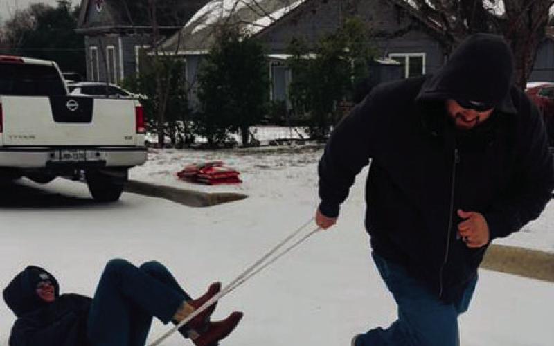 At right, Justin McDonald gives Payton Sanders a ride down Hetherly Street. HEATHER MCDONALD | COURTESY PHOTO