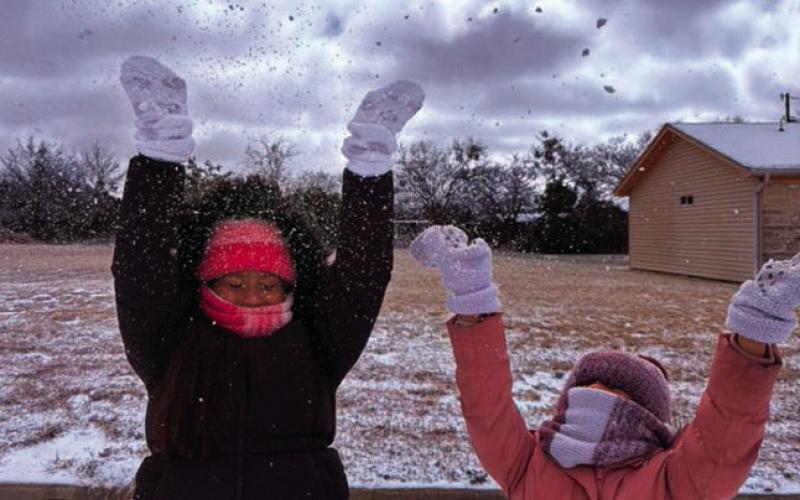 From left. Genesis &amp;amp; Galilea Hernández enjoy a bit of fun in the snow as clouds fill the skies. ABIGAIL CASTRUITA | COURTESY PHOTO