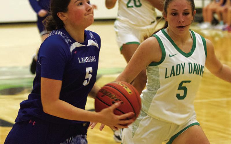 Brooke White drives to the basket against Burnet. HUNTER KING | DISPATCH RECORD