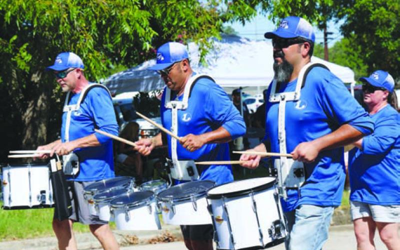 Badger Band Drum Line alumni from 1988-2000 played their drums throughout the entire Spring Ho parade route. JOYCESARAH MCCABE | DISPATCH RECORD