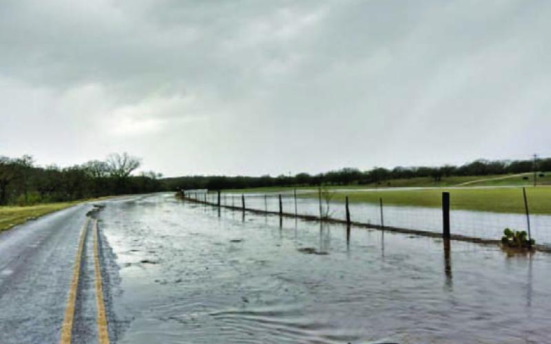 Water covers the FM 1478 roadway on Nov. 11 after a severe thunderstorm dropped 2.62 inches of rain across Lampasas, and hail pummeled cars, homes and businesses across town. Wind gusts of up to 50 mph also were reported by the National Weather Service. COURTESY PHOTO