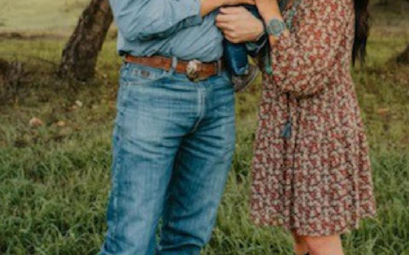 Heston and Stevie McBride recently won an Excellence in Agriculture honor from the Texas Farm Bureau. They are pictured here holding their son, Hetch. courtesy photo