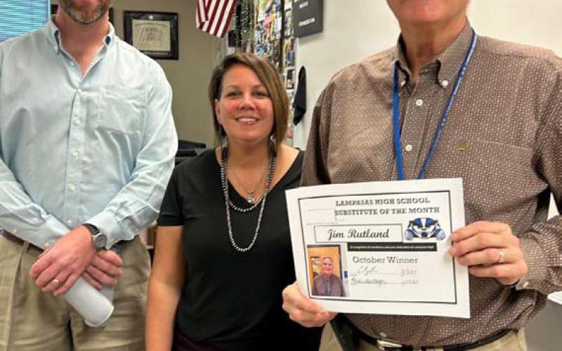 courtesy photo On hand to honor Jim Rutland, at right, as the October Substitute of the Month are Clay Phillips of Texas Farm Bureau Insurance and Dawn Fernandez, who oversees substitutes at Lampasas High School. “Rutland has filled in all over our school and done a wonderful job,” said Assistant Principal Ryan Race, not pictured.
