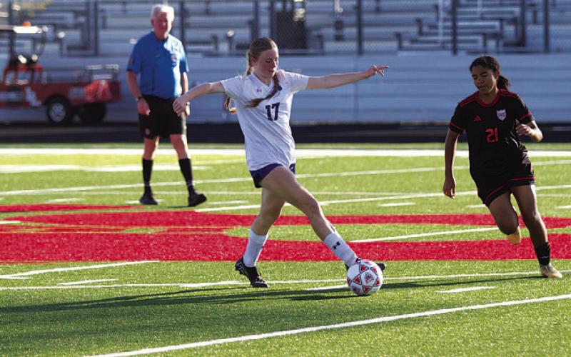 HUNTER KING | DISPATCH RECORD Kari Kepler intercepts a pass during the Lady Badgers’ playoff match.