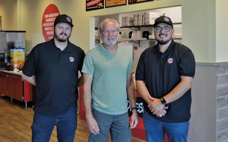 M 5 Enterprise executives, from left, Ben Hagan, John Hagan and Edgar Solis pose for a photo in front of the counter at Lampasas’ newest fast-casual dining restaurant, Teriyaki Madness. The restaurant is located next door to M 5’s Golden Chick franchise at 1702 Central Texas Expressway and is open seven days a week from 10 a.m. to 9 p.m. erick Mitchell | dispatch record