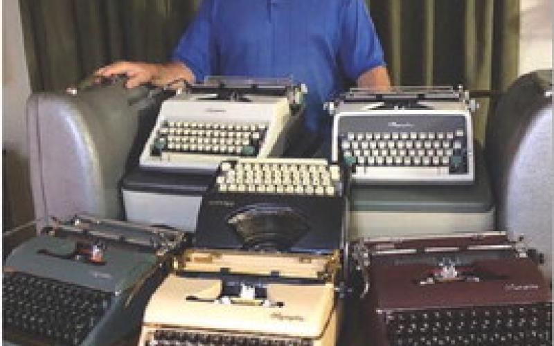 Rick Willis now has a collection of 35 typewriters, the oldest of which was made in 1919. He is pictured here with some of his favorite models. COURTESY PHOTO
