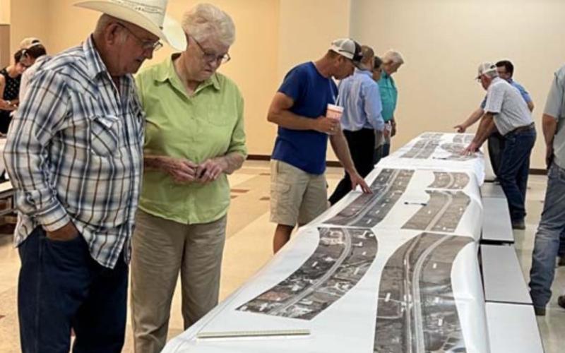 Landowners view a map of the U.S. 183 widening project that was displayed at last week’s event in Lometa. MASON HINES | DISPATCH RECORD