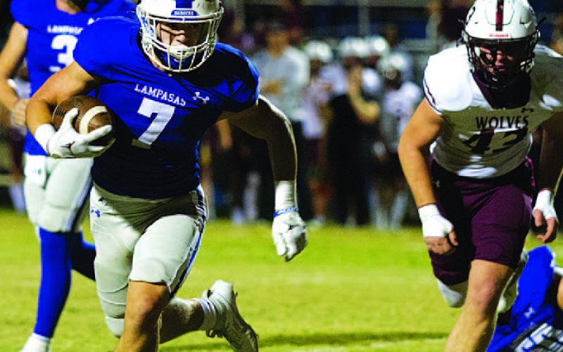 HUNTER KING | DISPATCH RECORD Jett Walker runs to the corner of the end zone for his lone touchdown of the game.