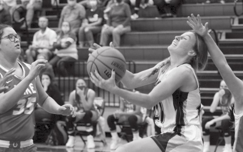 Cobie Chandler scores under the basket a day after recording her career-high 19 points against Elgin, a Conference 5A team. JEFF LOWE | DISPATCH RECORD