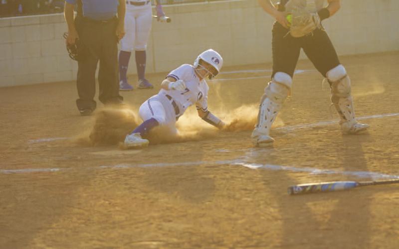 Maylee Kates slides into home plate during the first inning of the Lady Badgers’ game against Jarrell on Tuesday. HUNTER KING | DISPATCH RECORD