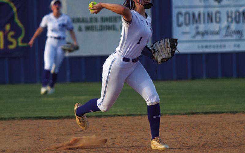 Gia Grasso throws from shortstop over the first base. HUNTER KING | DISPATCH RECORD