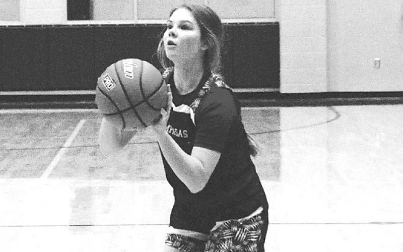 Addison Borchardt sets to release a three-point shot. HUNTER KING | DISPATCH RECORD